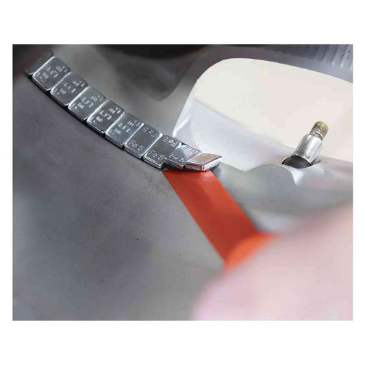 Grattoir poids adhésifs